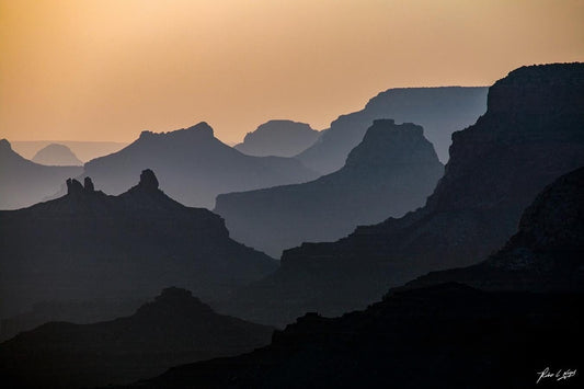 Grand Canyon Silhouette | Scenic Landscape Photography | This image showcases the majestic canyon against a stunning sunset backdrop.